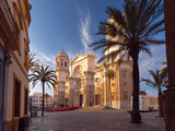 Fototapeta Boho - Cathedral of the Holy Cross in the central square of Cadiz at dawn.