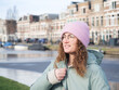 © DayfaPhoto - Content Young Woman with Curly Hair Enjoying Riverside View