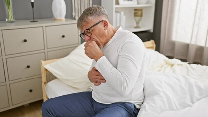 Sticker - Unwell middle age man, grey-haired, coughing heavily in his bedroom, likely bronchitis. cloaked in pyjamas, this health care alert sets a somber mood.