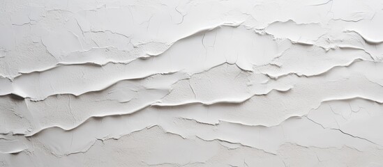 Poster - A close up of a grey wall with a cracked texture, resembling a fluid landscape on a slope. The monochrome pattern looks like liquid event or snow