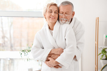 Wall Mural - Mature couple hugging after shower in bathroom