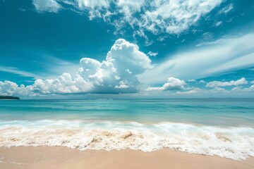 Bright sun over beach with turquoise water.