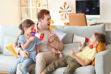 Sticker - Father and his children with megaphones at home. April Fool's Day prank