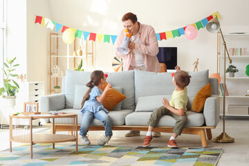 Sticker - Father surprising his children with megaphone at home. April Fool's Day prank