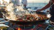 A closeup of a seafood paella being cooked in a large traditional pan by a team of chefs on the lower deck of the yacht the tantalizing aroma of es filling the air.
