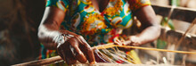 A Woman Weaving In The Traditional Way, Creating Beautiful Textiles