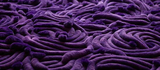  A close up of a vibrant purple woolen fabric with a swirling pattern in shades of violet, pink, magenta, and electric blue, creating a stunning piece of art
