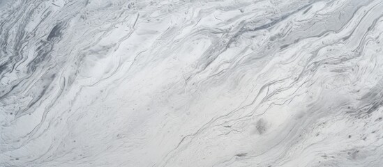 Wall Mural - A detailed shot of a grey marble texture resembling freezing snow patterns on a winter slope, with furlike cumulus clouds in the background