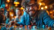 Man with glasses smiling while playing board game, enjoying leisure event
