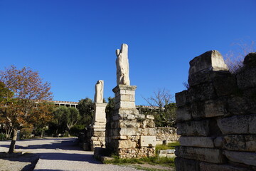 Wall Mural - Columns with statues in the ruins of the Odeon of Agrippa, concert hall, in the Ancient Agora, or marketplace, in Athens, Greece