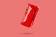 Blank red foil tomato ketchup sauce sachet package float on red background