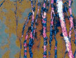 abstract illustration of vertical lines and ocher, blue and pink tones