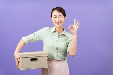 Wall Mural - Photo of young Asian woman on purple background