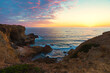 sinking sun over atlantic ocean algarve, rocky cliffs carrapateira portugal landscape