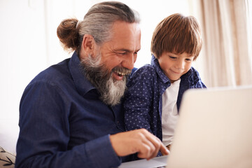 Poster - Smile, laptop and grandfather with boy and games, playing and fun in home living room. Happy, streaming or elearning online and internet in house with child, technology and computer for learning