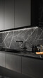 A modern kitchen featuring dark cabinets and an elegant marble backsplash with warm lighting