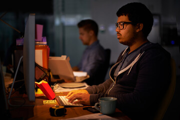 Poster - Coding, computer and night with programmer man at desk in office for cyber security development. Fast food, programming and software with confident young game developer in workplace for overtime
