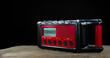 Black and red weather radio with tornado warning and copy space