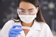 © Tasneem/peopleimages.com - Scientist, mask and woman with petri dish for blood analysis, experiment or research in laboratory. Science, glasses and medical professional with culture plate, study and inspection for dna test