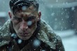 soldier with short hair, under the snow of intense winter with a look of hatred