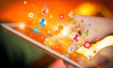 Poster - Close-up of a hand using tablet with social media icons