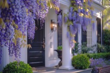 Lavender Wisteria Flowers Drape Gracefully Over The Porch Of An Elegant House
