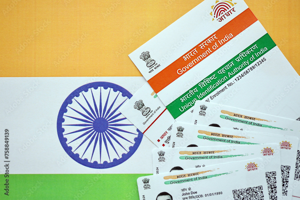 Indian Aadhaar card from Unique Identification Authority of India on Indian flag close up