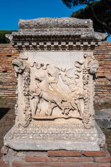 Sticker - Detail of Medieval sarcophagus carved in marble exhibited outdoors in Ancient Ostia