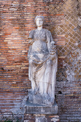 Wall Mural - Ancient roman statue portraiting a woman wearing a tunic