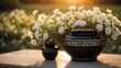 Elegant black urn containing ashes with white flowers, a solemn memento of a life remembered. 