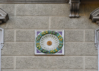 Canvas Print - Colorful decoration in the shape of fruit garland on the facade of an old building, Turin, Piedmont, Italy