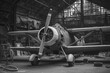 old vintage propeller airplane in the airport hangar .black and white photography