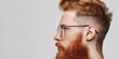 A man with a red beard and glasses, suitable for business or casual concepts