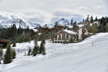 Wall Mural - Winter scenery of ski resort Courchevel with its chalets on the slopes 