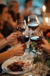 © Ева Поликарпова - A group of people raising their wine glasses in a toast. Ideal for celebrations and social events