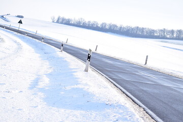 Wall Mural - cleared road in snow covered land