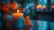 Illuminated Candle and Flowers on Table