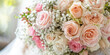 bridal bouquet pale pink roses and mixed flowers  holded by blonde bride