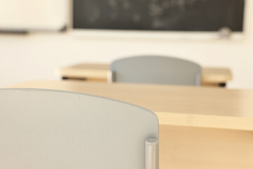 Wall Mural - Empty school classroom with desks and chairs