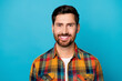 Photo of optimistic cheerful positive man with beard dressed plaid shirt toothy smiling at camera isolated on blue color background