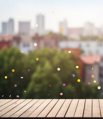 Wall Mural - Empty wooden board against the backdrop of a green city and confetti. Background for product presentation and demonstration