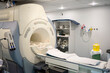 © Albert Martinez/Stocksy - Modern CT machine in hospital