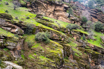 Wall Mural - Tasyaran canyon, which attracts attention with its rock shapes similar to Antelope canyon in Arizona, offers a magnificent view to its visitors. Canyon view and stream at sunset. Usak, Turkey.