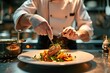 © SaroStock - Chef masterfully preparing a fancy gourmet meal