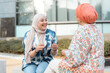 © Santi Nuñez/Stocksy - Portrait of glad muslim women friends having fun