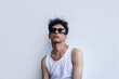 © Roman Shalenkin/Stocksy - Young Hispanic man in trendy sunglasses