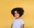© Hernandez & Sorokina/Stocksy - Little Girl With Afro Hair Studio Portrait