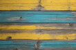 yellow and turquoise painted and black and brown old dirty weathered outdoor wood wall wooden plank board texture background with grains and structures