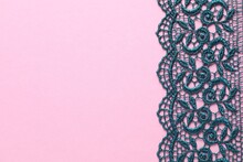 Green Lace On Pink Background, Top View. Space For Text
