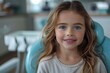 © Raptecstudio - Iris, the happy toddler with blond hair, smiles in the dental chair